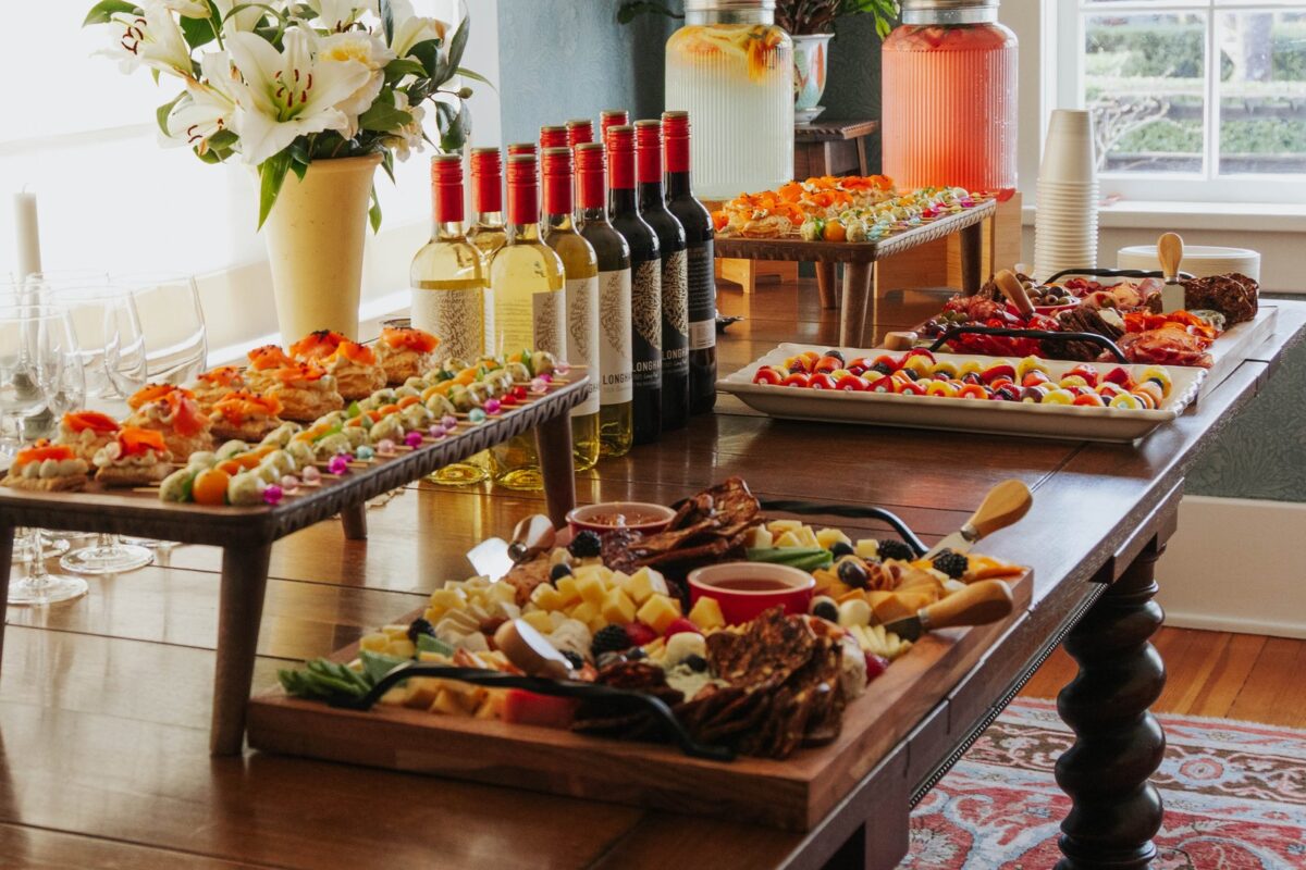 Grysh & Ko catering display with flowers and beautifully presented appetizers